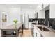 Well-lit kitchen featuring stainless steel appliances, contrasting countertops and dark backsplash at 2851 W 52Nd Ave # 404, Denver, CO 80221
