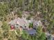 Beautiful exterior view of a house nestled amongst the trees in a mountainous location at 4158 Wild Flower Ct, Evergreen, CO 80439