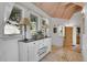 Charming foyer with natural light and functional storage, complete with a statement rug at 4158 Wild Flower Ct, Evergreen, CO 80439