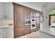 A well appointed kitchen with wood cabinets, stainless appliances and stone countertops at 4158 Wild Flower Ct, Evergreen, CO 80439