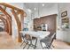 Spacious kitchen with stone countertops, pendant lighting and custom cabinetry at 4158 Wild Flower Ct, Evergreen, CO 80439