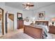 Bedroom featuring a wooden dresser, an upholstered bed, and neutral walls at 4158 Wild Flower Ct, Evergreen, CO 80439