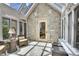 Bright sunroom features stone wall, comfortable seating and sun-drenched atmosphere at 4158 Wild Flower Ct, Evergreen, CO 80439