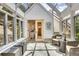 Inviting sunroom with plenty of natural light featuring glass ceilings and tiled flooring at 4158 Wild Flower Ct, Evergreen, CO 80439