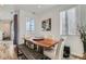 The dining area boasts a unique wood table and bench with lots of natural light at 12301 Festival Ln, Thornton, CO 80241