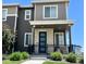 Charming two-story home with a stone-accented entrance and well-manicured landscaping at 12301 Festival Ln, Thornton, CO 80241