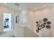 Bright hallway featuring white walls, recessed lighting, and decorative wall art at 12301 Festival Ln, Thornton, CO 80241