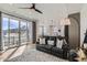 Open living room features sliding glass doors, hardwood floors, and a kitchen view at 12301 Festival Ln, Thornton, CO 80241