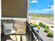 Relaxing porch view with comfortable chair and open street view, perfect for enjoying the outdoors at 12301 Festival Ln, Thornton, CO 80241