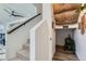 Carpeted stairway leading to a lower level with a sign for an office at 12301 Festival Ln, Thornton, CO 80241