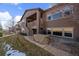 Charming home backyard features a patio and tiered deck perfect for entertaining at 15789 W 95Th Pl, Arvada, CO 80007