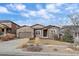 A well-kept lawn and an attractive exterior give this home great curb appeal at 15789 W 95Th Pl, Arvada, CO 80007