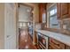 Gourmet kitchen featuring wooden cabinets, stainless steel appliances, and hardwood floors at 15789 W 95Th Pl, Arvada, CO 80007