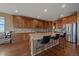 Spacious kitchen with a large island, stainless steel appliances, and wooden cabinets at 15789 W 95Th Pl, Arvada, CO 80007