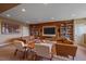 Open-concept living room features built-in bookshelves and a large entertainment center at 15789 W 95Th Pl, Arvada, CO 80007