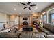 Cozy living room with fireplace and comfortable seating arrangement at 15789 W 95Th Pl, Arvada, CO 80007