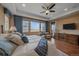 Spacious main bedroom with a large window, wood floors, and ample natural light at 15789 W 95Th Pl, Arvada, CO 80007