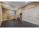 This dedicated workout room has rubber floors and is ready for your gym equipment at 15789 W 95Th Pl, Arvada, CO 80007