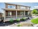 This is an image of the exterior of the house with a covered front porch and landscaping at 9607 Williamsburg St, Littleton, CO 80125