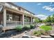 This is an image of the exterior of the house with a covered front porch and landscaping at 9607 Williamsburg St, Littleton, CO 80125