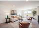 Comfortable upstairs living room with plenty of light and comfortable seating at 9607 Williamsburg St, Littleton, CO 80125