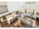 Bird's eye view of an open-concept living and dining area with hardwood floors and modern decor at 9607 Williamsburg St, Littleton, CO 80125