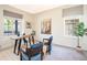 Bright home office with a rustic wooden desk, comfortable seating, and ample natural light at 9607 Williamsburg St, Littleton, CO 80125