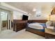 Basement bedroom featuring wood paneled walls, a full bed, and a large dresser at 1211 S Zuni St, Denver, CO 80223