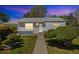 Charming single story home showcasing a well maintained lawn and mature trees at 1211 S Zuni St, Denver, CO 80223