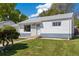 Charming single-story home with a landscaped front yard and inviting walkway at 1211 S Zuni St, Denver, CO 80223