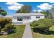 Charming single-story home with a landscaped front yard and inviting walkway at 1211 S Zuni St, Denver, CO 80223