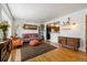 Cozy living room featuring hardwood floors, a comfortable sofa, and stylish decor at 1211 S Zuni St, Denver, CO 80223