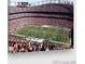 Aerial view of a stadium filled with fans during an exciting football game at 1211 S Zuni St, Denver, CO 80223
