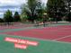 Huston Lake community tennis courts surrounded by mature trees at 1211 S Zuni St, Denver, CO 80223