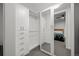 Spacious walk-in closet with ample storage, including shelving and drawers, offering convenient organization at 1750 Wewatta St # 605, Denver, CO 80202