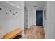 Bright entryway with built-in bench and storage space, with vinyl flooring at 1750 Wewatta St # 605, Denver, CO 80202