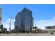A modern apartment building featuring clean lines, large windows, street-level retail, and a pedestrian-friendly environment at 1750 Wewatta St # 605, Denver, CO 80202