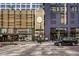 A contemporary building with retail space, modern signage, street parking, and a pedestrian-friendly environment at 1750 Wewatta St # 605, Denver, CO 80202