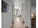 Hallway leads to a bright room with a large window and a view of the city at 1750 Wewatta St # 605, Denver, CO 80202