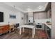 Modern kitchen with stainless steel appliances and a breakfast bar with seating at 1750 Wewatta St # 605, Denver, CO 80202