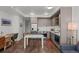 A stylish kitchen is featured with stainless steel appliances, custom cabinets, and a dining area at 1750 Wewatta St # 605, Denver, CO 80202