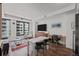Bright living room features large windows, hardwood floors, and modern furnishings at 1750 Wewatta St # 605, Denver, CO 80202