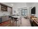 Bright and modern living room featuring sleek furnishings, a large window with city views and an open floor plan at 1750 Wewatta St # 605, Denver, CO 80202