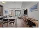 Bright living room featuring hardwood floors, modern furniture, and large windows at 1750 Wewatta St # 605, Denver, CO 80202