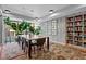 Bright lounge area featuring a large wooden table, library shelves, and natural light from large windows at 1750 Wewatta St # 605, Denver, CO 80202