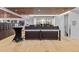 Modern reception area with wood floors and a decorative wood panel ceiling at 1750 Wewatta St # 605, Denver, CO 80202