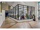 Bright retail space with large glass windows displaying clothing racks and store merchandise at 1750 Wewatta St # 605, Denver, CO 80202