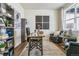 Stylish home office with a cozy chair, unique decor and a large window at 27756 E Byers Pl, Aurora, CO 80018