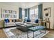 Inviting living room with comfortable seating, stylish decor, and abundant natural light at 27756 E Byers Pl, Aurora, CO 80018