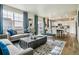 Bright, open-concept living space with lots of natural light and modern decor at 27756 E Byers Pl, Aurora, CO 80018